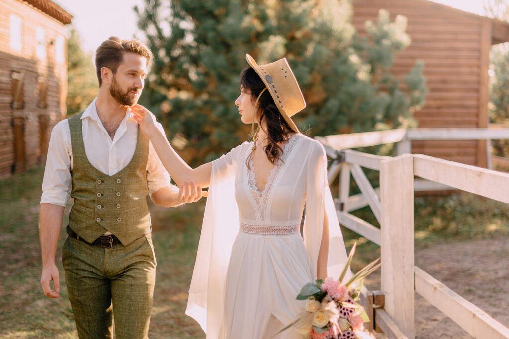 newlyweds-walk-on-ranch-on-a-summer-day